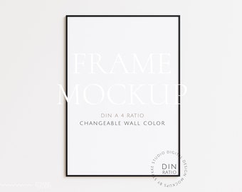 May include: A black frame mockup with the text "FRAME MOCKUP" and "DIN A 4 RATIO CHANGEABLE WALL COLOR" in white text. The frame is on a white wall.