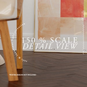 May include: A close-up of a framed abstract art print with a gold frame. The print features a watercolor design with shades of pink, orange, and red. The text "150% SCALE DETAIL VIEW" is printed below the frame. The text "*POSTER DESIGNS NOT INCLUDED" is printed below the image.