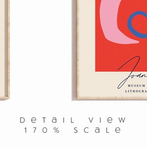 May include: Two framed art prints. One features green leaves and black script on a cream background. The other has a red background with pink and blue abstract shapes. The text "Joan" and "Museum of Modern Lithography Collection" is visible.