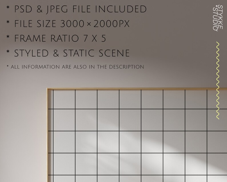 May include: A light grey wall with a wooden frame around a grid of white squares. The frame is casting a shadow on the wall. The text "*STUDIO" and "STYKKE*" is on the right side of the image.