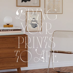 May include: A white dresser with three drawers and a white chair with a clear plastic seat. The dresser is decorated with books and a lamp. The wall behind the dresser is white and has two framed prints hanging on it. The text "BRING YOUR PRINTS TO LIFE" is written in white on the wall.