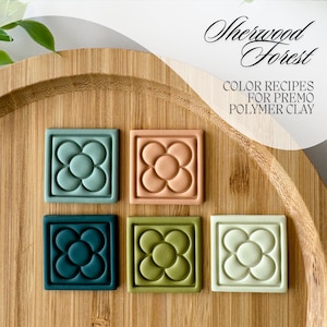 May include: Six square polymer clay tiles with a raised flower design in various colours: teal, peach, dark green, olive green, and white. The tiles are arranged in two rows of three on a wooden surface. The text "Sherwood Forest" and "Color Recipes for Premo Polymer Clay" is written above the tiles.