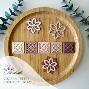 May include: A wooden tray displays polymer clay pieces in rose neutral tones. The arrangement includes flower-shaped and square tiles with floral designs. The text "Rose Neutrals" and "COLOR RECIPES FOR PREMO POLYMER CLAY" are also visible.