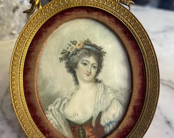 A French Minature Portrait of a Lady in an Orante Bronze Frame