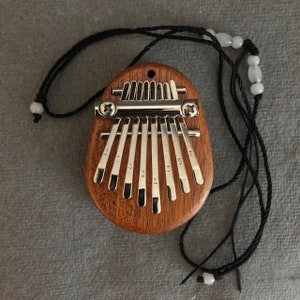 10 Key Kalimba Mini Portable Thumb Piano Finger Percussion Keyboard Pocket  Musical Instrument with Random Color Necklace Acrylic