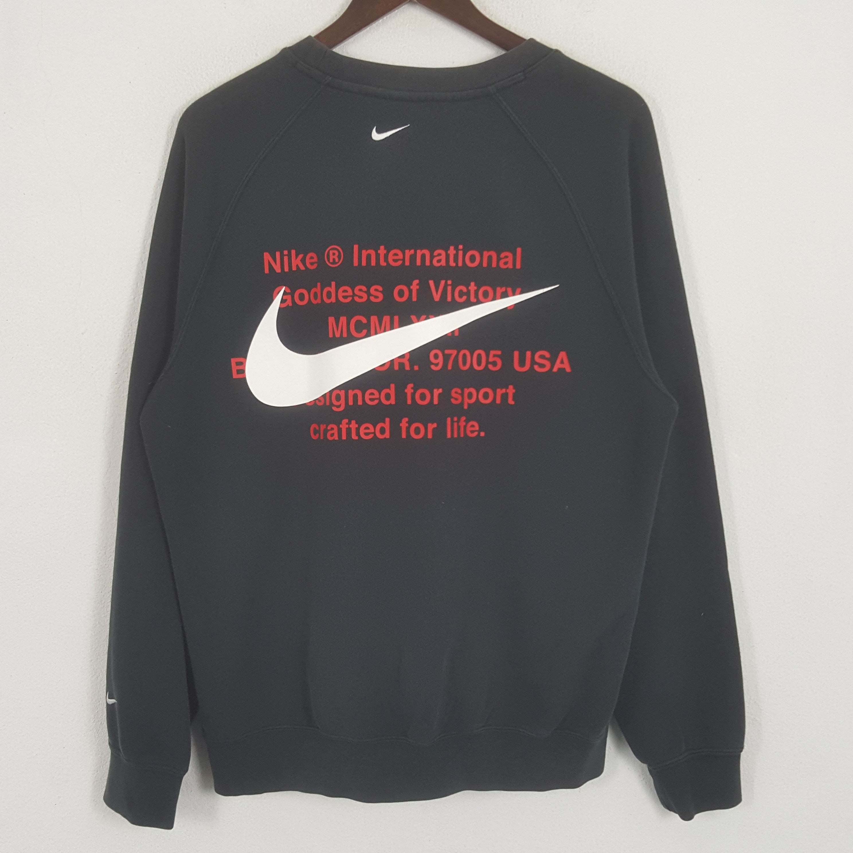 NIKE 古着 90sロゴ入り紫クルーネックスウェットインターナショナル M