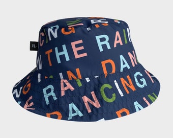 Pluvo Bucket Hat Fashion Dancing in the Rain. Clothing Print. Gifts for Women. Gifts for Men. Unisex Bicycle Jacket Poncho