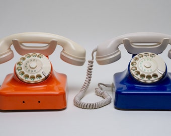 Vintage landline phones from the 1960-70&#39;s in colour blue  and orange, made in Germany