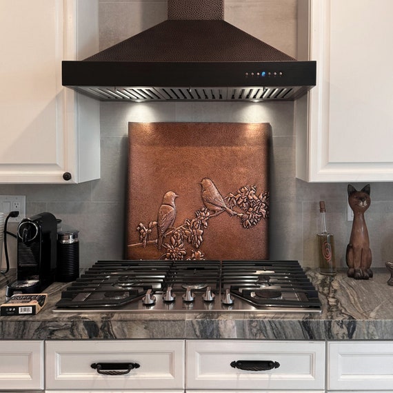 Black tree on stainless steel backsplash - Copper & Craft