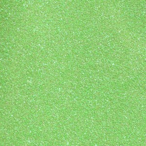 Puede incluir: Primer plano de un fondo de purpurina verde claro.
