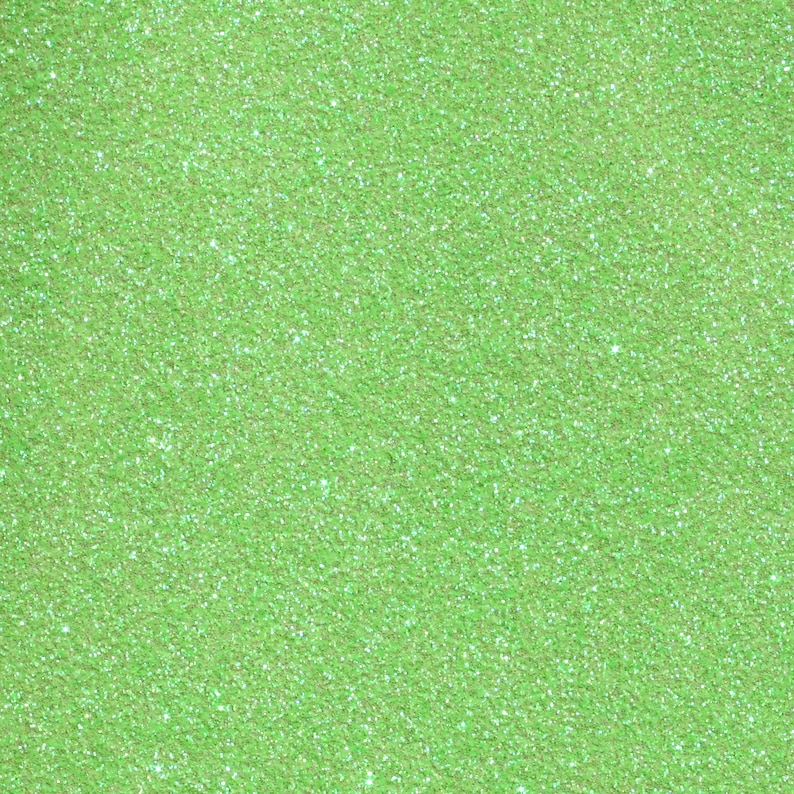 Puede incluir: Primer plano de un fondo de purpurina verde claro.