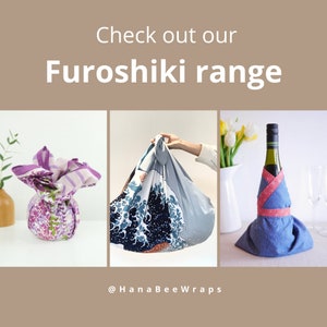 May include: Image showcasing a range of Furoshiki wraps. The image features three examples: a purple floral wrap, a blue wave-patterned wrap, and a blue wrap with a red patterned ribbon around a wine bottle. Text reads "Check out our Furoshiki range".