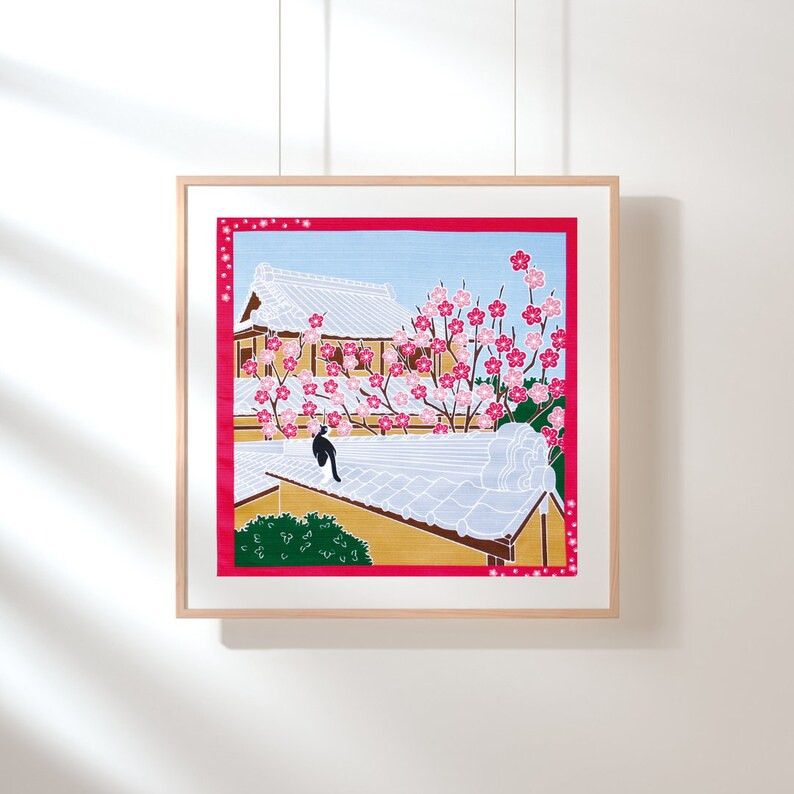 May include: A framed illustration of a Japanese building with a tiled roof and a cherry blossom tree in bloom. The building is painted in shades of brown and white, while the tree is pink and green. A black and white bird sits on the roof.