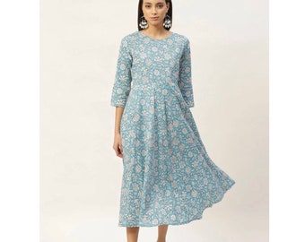 May include: A light blue midi dress with a white floral print. The dress has a round neckline and 3/4 sleeves.