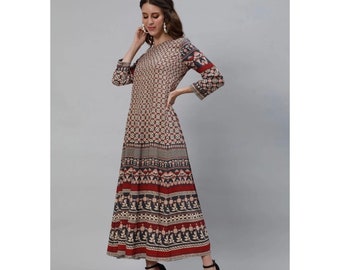 May include: A long, flowing dress with a floral print in shades of beige, black, and red. The dress has a round neckline and three-quarter sleeves.