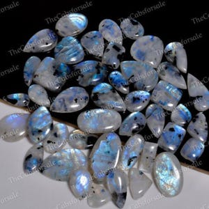 Magnifique cabochon ovale en pierre de lune arc-en-ciel en pierre de lune tourmaline noire, lot de mélange, 150 carats (3-5 pierres)
