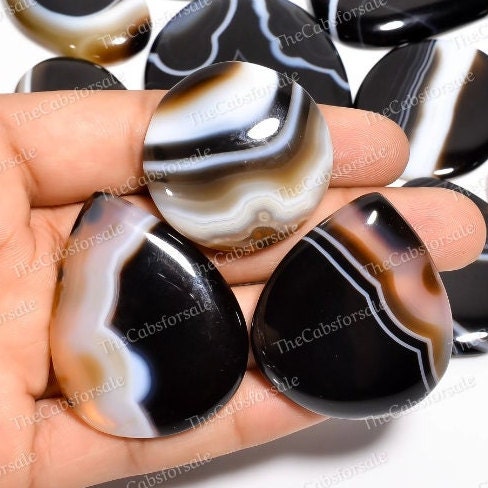 White gemstone with black lines deals