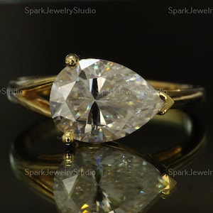 Pear Cut Moissanite Engagement Ring – East West Solitaire in 14k Yellow Gold