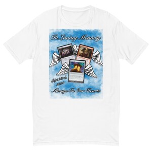 May include: White t-shirt with a blue and white design featuring three Magic: The Gathering cards with angel wings and the text "In Loving Memory Sept 28th 2021 Always In Our Hearts".