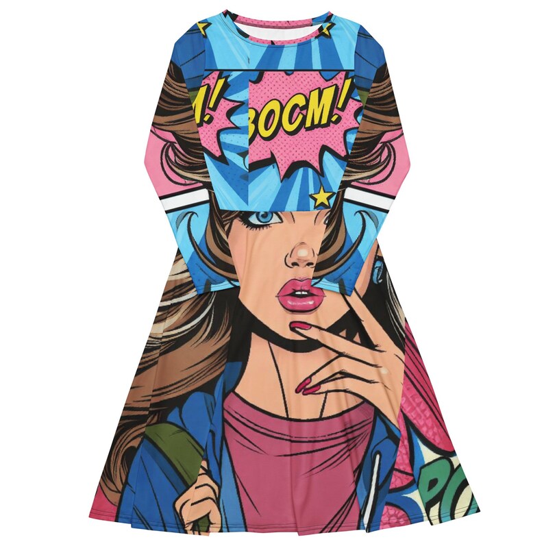 May include: A long-sleeved dress featuring a pop art comic book style design. The dress has a vibrant illustration of a woman with the word "BOOM!" in a speech bubble. The color palette includes pink, blue, and brown.