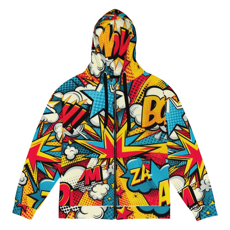 Puede incluir: Una sudadera con capucha de cremallera amarilla, roja, azul y negra con un patr&oacute;n de c&oacute;mic. El patr&oacute;n presenta palabras como "WOW", "BAM" y "ZA", junto con estrellas y rayos.