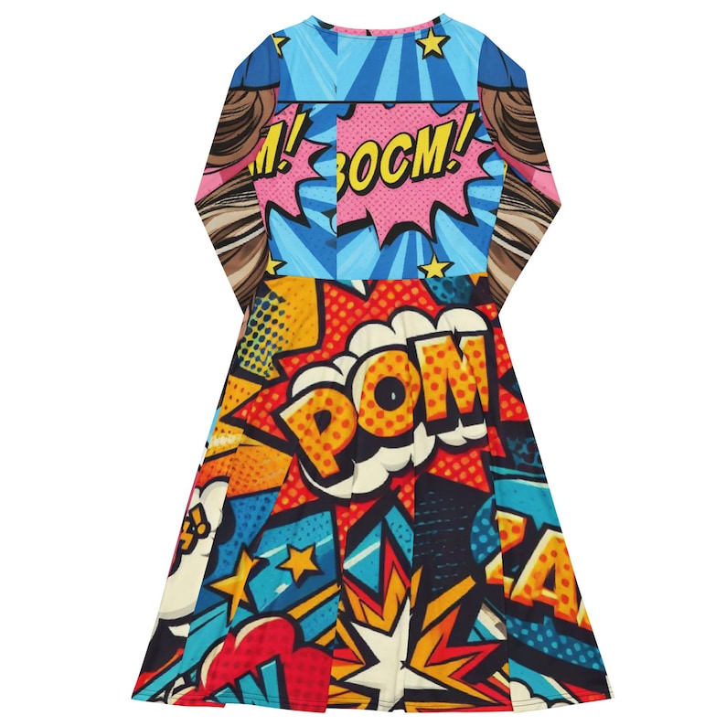 May include: A long-sleeved dress with a vibrant comic book-style design. The dress features the words "BOOM!" and "POM!" in speech bubbles, along with starbursts and star accents. The color palette includes blue, pink, red, yellow, and black.