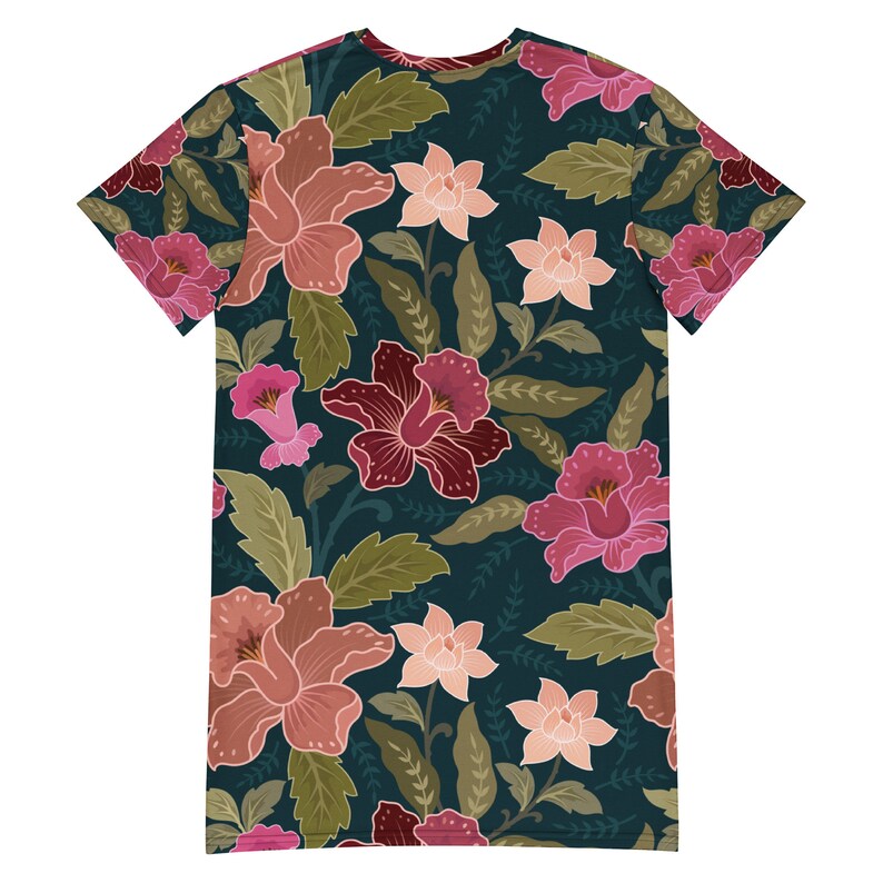 May include: A dark teal t-shirt with a floral print featuring pink, red, and peach flowers with green leaves.