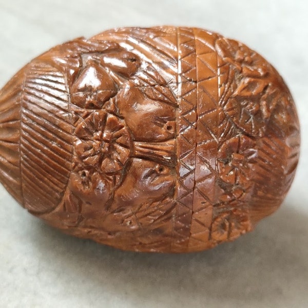 An Antique Carved Coquilla Nut Egg