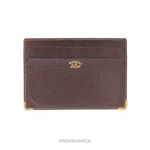 Tarjetero Gucci de piel marrón con logo vintage
