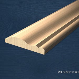 May include: A section of unfinished wooden molding with a decorative profile. The molding has a curved top edge and a flat bottom edge, with a stepped design. The wood grain is visible, and the piece is angled against a dark blue background.