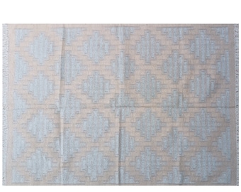 May include: A light beige rug with a geometric pattern in a lighter shade of gray. The rug has a fringe border.