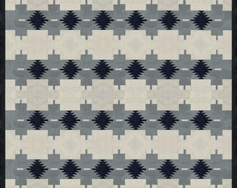 May include: A black and white geometric pattern rug with a repeating diamond design. The rug has a cream background with black and grey diamonds.