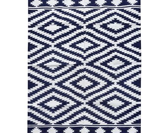 May include: A black and white geometric patterned rug with a burgundy border. The rug has a diamond pattern with a white background and black diamonds.
