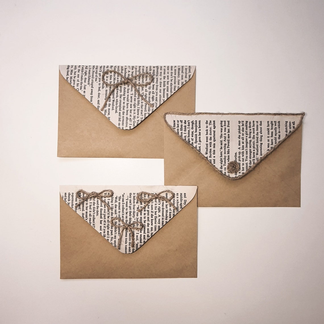 Handdecorated letter bags with rope and book pages for Etsy