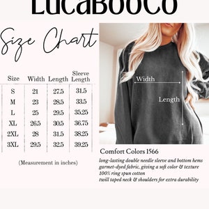 May include: Size chart for a long-sleeved sweatshirt with measurements in inches for width, length, and sleeve length. The chart includes sizes S, M, L, XL, 2XL, and 3XL. The sweatshirt is gray and has a double needle sleeve and bottom hems. The fabric is 100% ring spun cotton with a twill taped neck and shoulders.