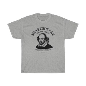 May include: Grey t-shirt featuring a black and white illustration of William Shakespeare. The text reads "Shakespeare. Drama Queen. Specialising in love, death, revenge & jealousy. - Since 1564 -"