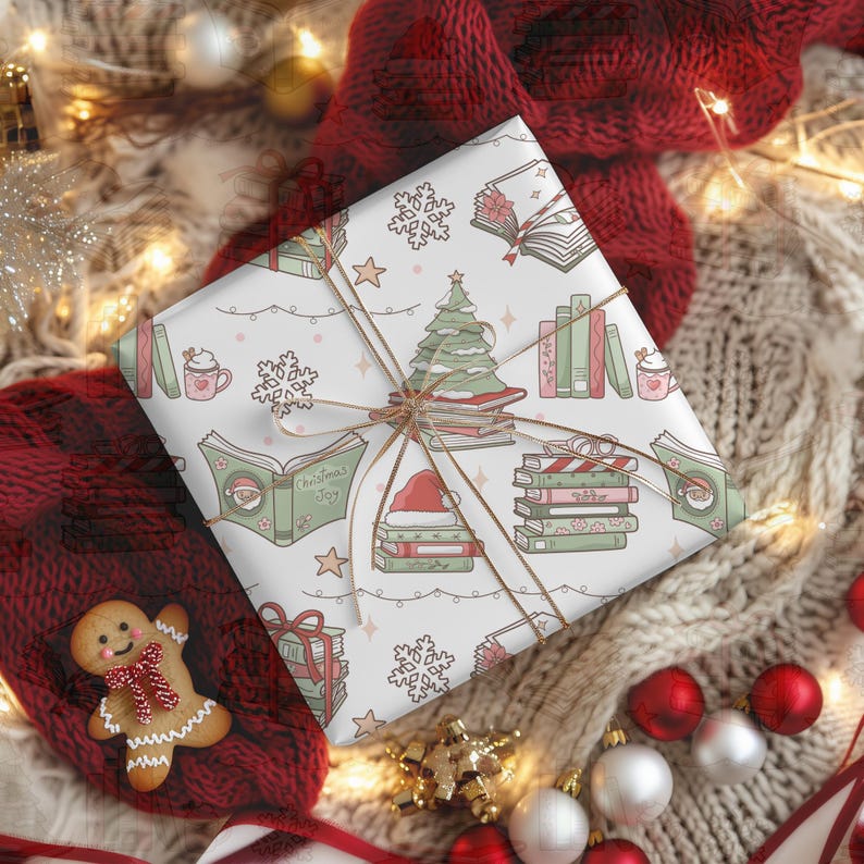 May include: A wrapped gift with a festive Christmas-themed pattern featuring books, Christmas trees, snowflakes, and Santa hats. The gift is tied with twine and rests on a cozy, textured surface with Christmas ornaments.