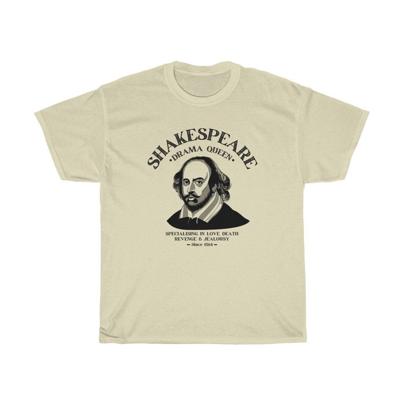 May include: A beige t-shirt featuring a black graphic of William Shakespeare. The graphic includes the text "Shakespeare, Drama Queen, Specialising in Love, Death, Revenge & Jealousy - Since 1564 - "