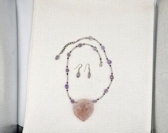Hand carved rose quartz pendant necklace on amethyst /quartz beaded chain with amethyst drop earrings .  silver hand shake slide on back