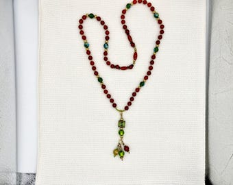 Carnelian pendant and glass necklace with vintage Monet beads and  green faceted glass beads