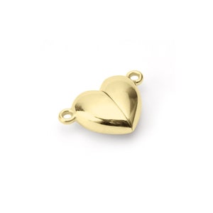 Puede incluir: Cierre de coraz&oacute;n dorado con dos bucles para sujetar a un collar o pulsera.