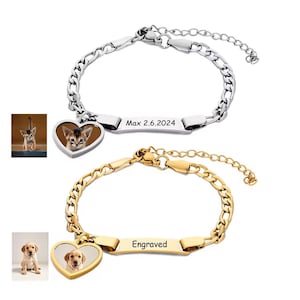 May include: Two personalized bracelets. One is silver-toned with a heart-shaped charm featuring a cat photo and the text "Max 2.6.2024". The other is gold-toned with a heart-shaped charm featuring a dog photo and the text "Engraved".