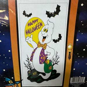 May include: A rectangular Halloween decoration featuring a cartoon ghost wearing a purple vest with yellow triangles and a polka-dot bow tie. The ghost holds a green treat bag with a pumpkin icon. Text reads HAPPY HALLOWEEN against a yellow moon.