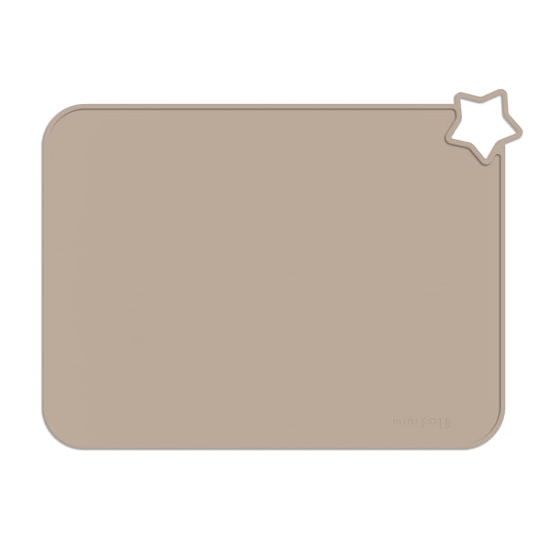 May include: A beige silicone placemat with a star-shaped cutout in the top right corner. The placemat has the word "minifolk" printed in the bottom right corner.