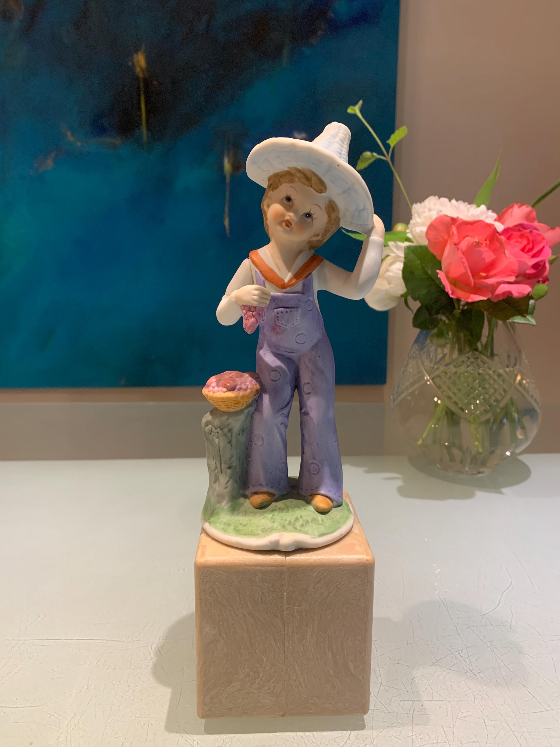 Vintage Porcelain Boy Figurine by UCGC. Please read the description.