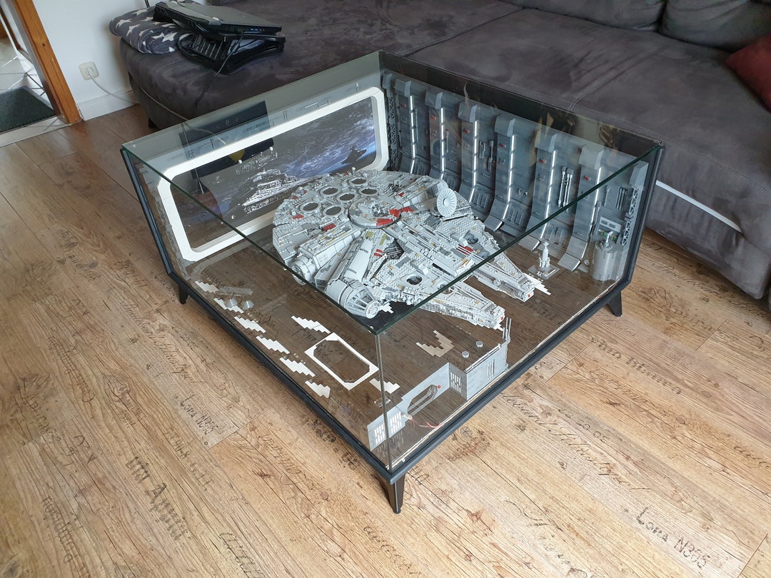 Glass coffee table lego millennium falcon hotsell