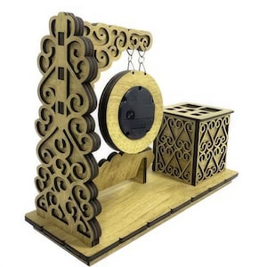 May include: Wooden desk organizer with a gong, a pen holder, and intricate carvings. The gong is suspended from the top of the organizer and has a black center.