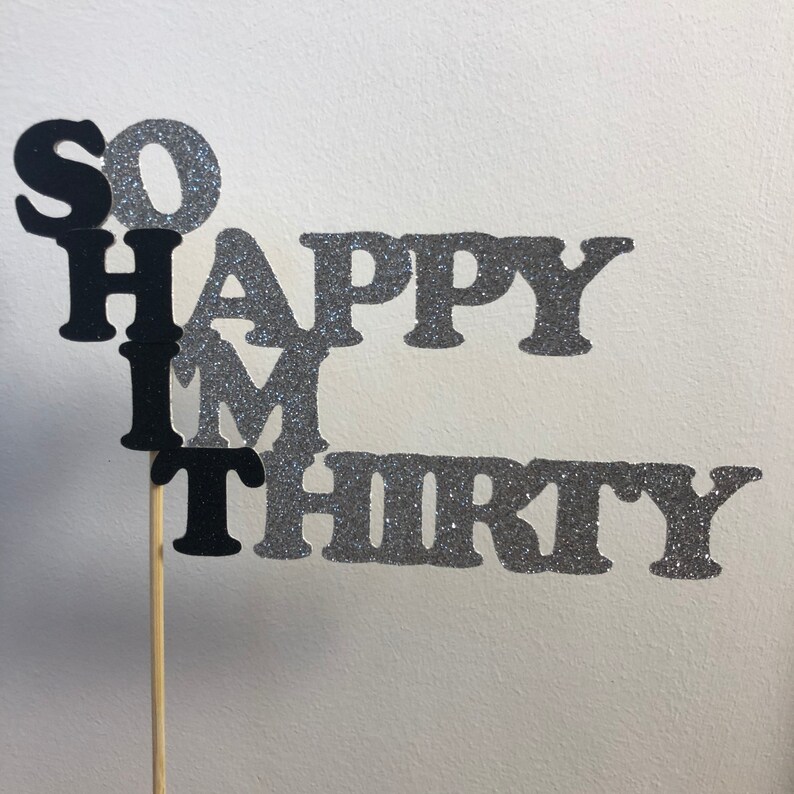 May include: Black and silver glitter cake topper with the text "So Happy I'm Thirty".