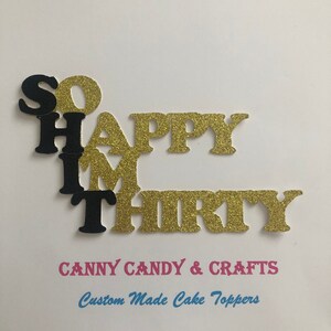 May include: Gold glitter cake topper that says "So Happy I'm Thirty". The letters are black and gold. The topper is made by Canny Candy & Crafts, Custom Made Cake Toppers.