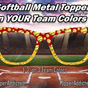 May include: Softball Metal Toppers for Pair Eyewear in Your Team Colors. The image shows a pair of glasses with a red frame decorated with yellow softballs. The background is a baseball field with the text "1, 2, or 3 Team Colors."